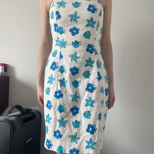 Mini dress, white with blue flowers. Cute outline and tight fit, never worn
